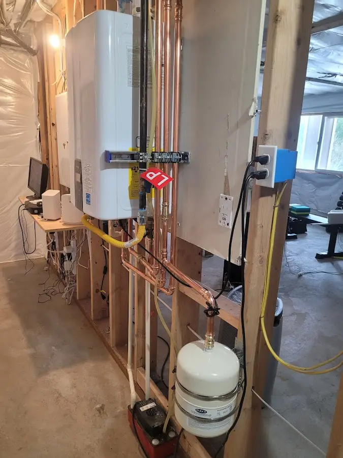 Licensed plumber repairing a kitchen sink in Deer Park